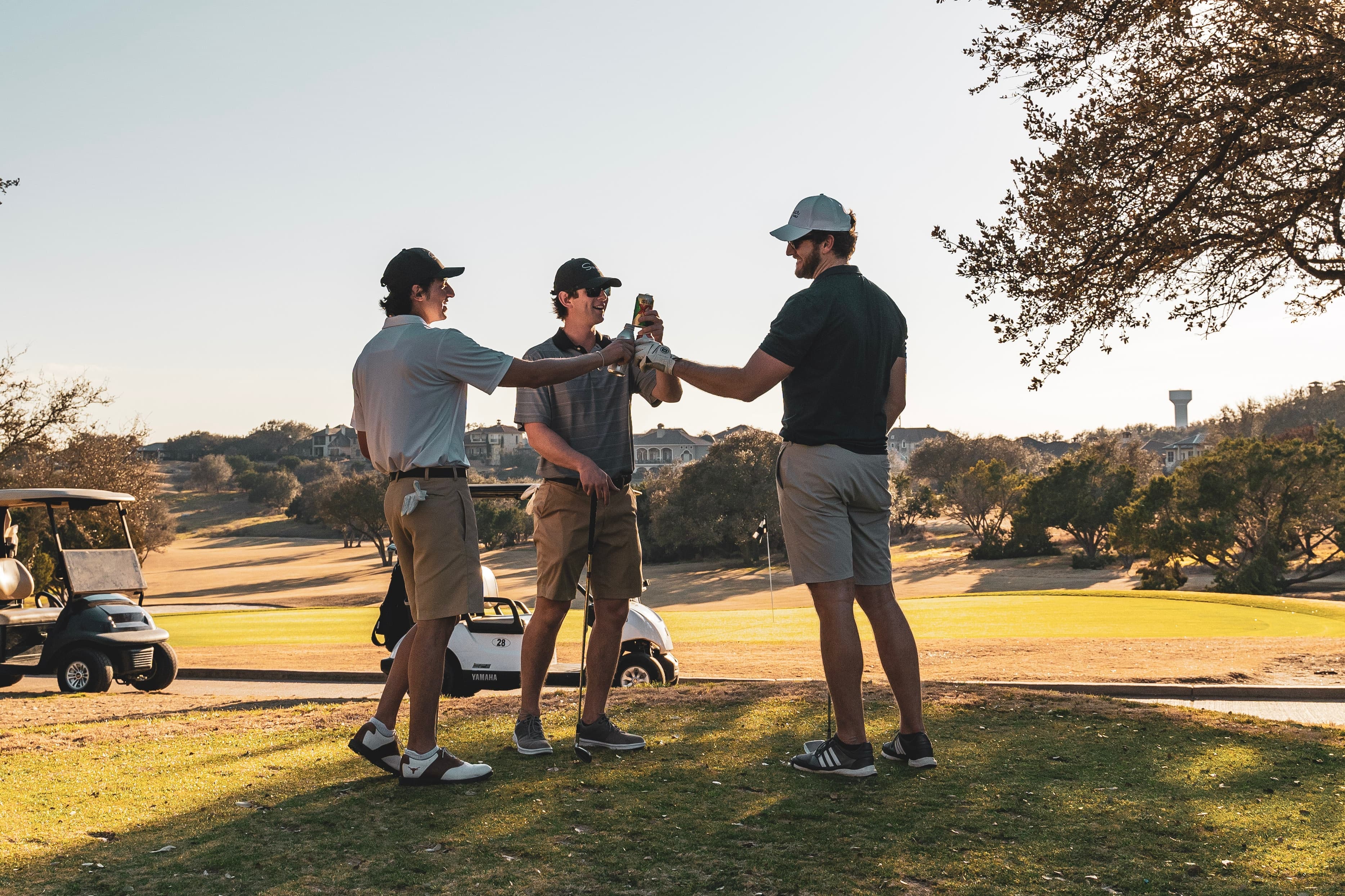 a group of men golfing